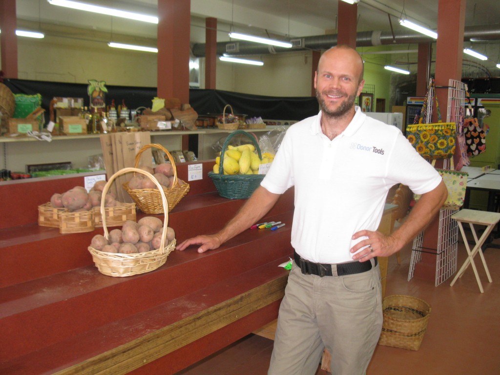 Store manager Ryan Heneise poses by our potatoes he helped us find a good spot for