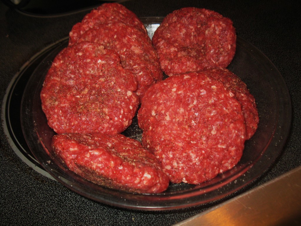 Seasoned patties ready for the grill