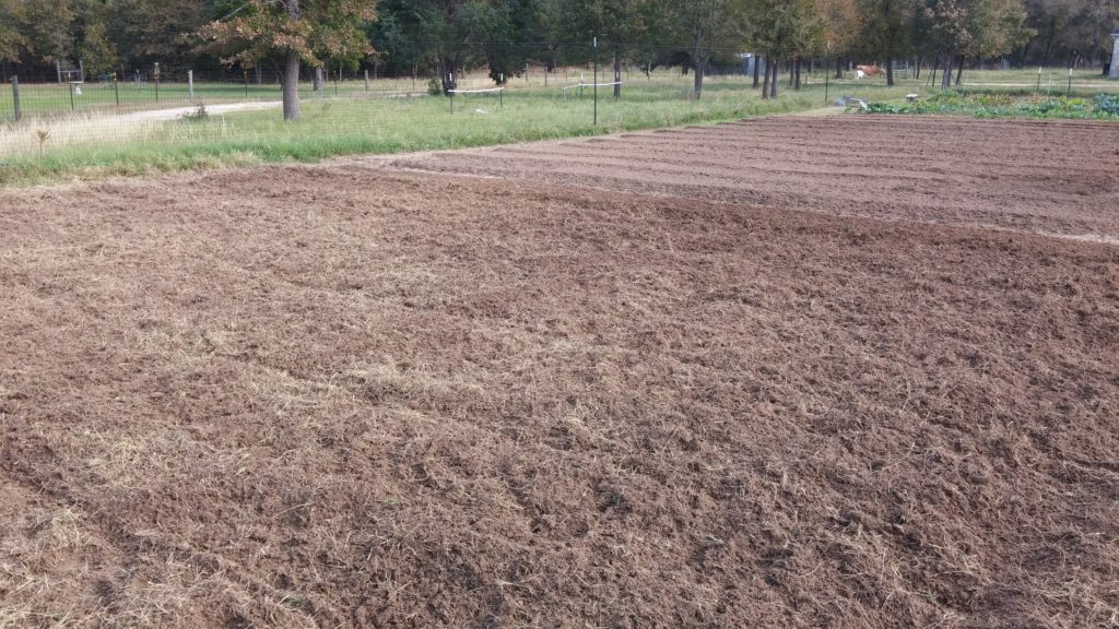 Field area fully planted, 3rd tilling to incorporate fertilizer and seed completed. Each row has a different type of seed.